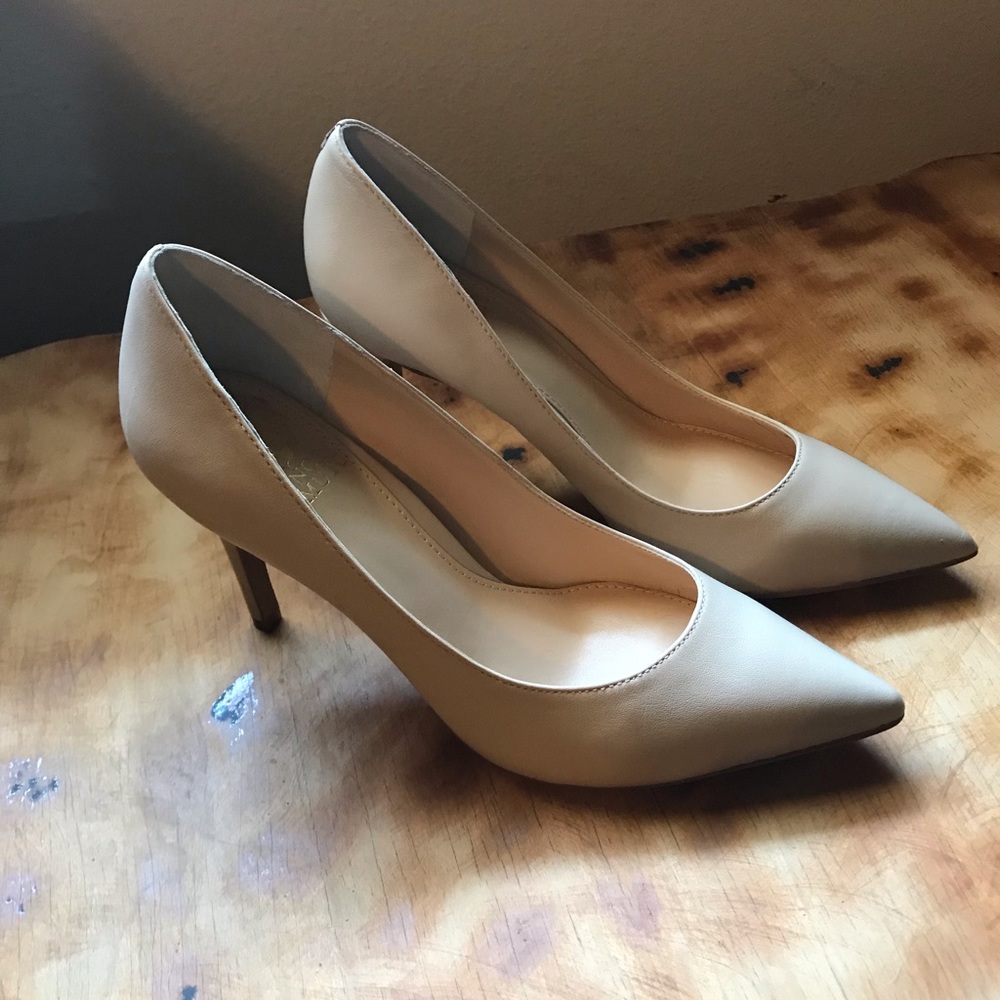 Beige pointed-toe pumps